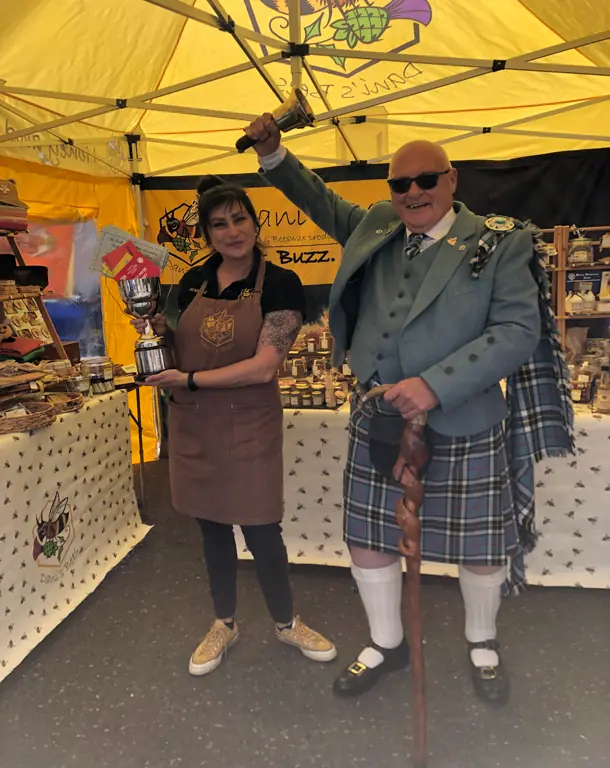 Dani holding two first prizes