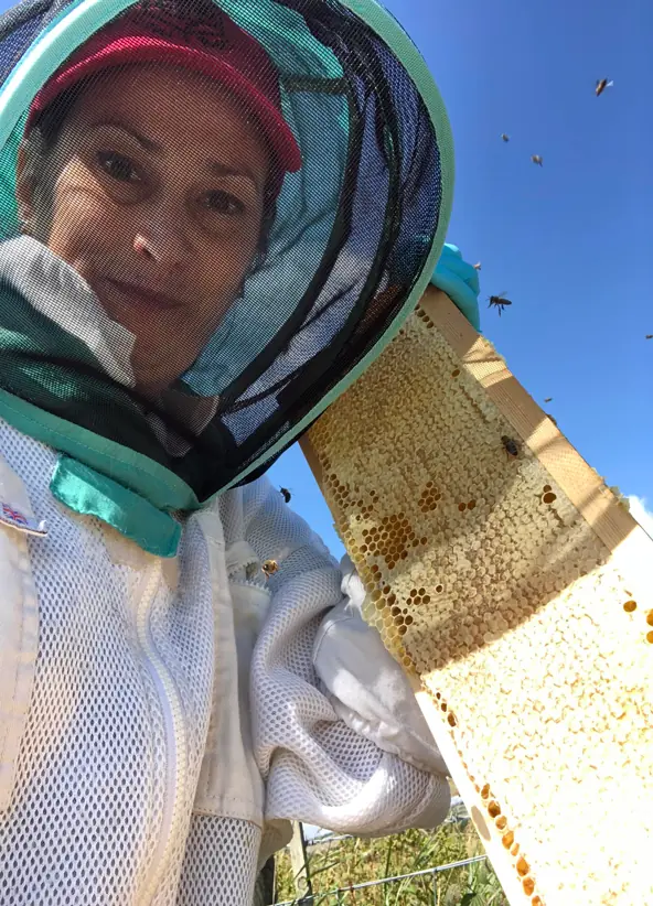 Dani in her beekeeping suit